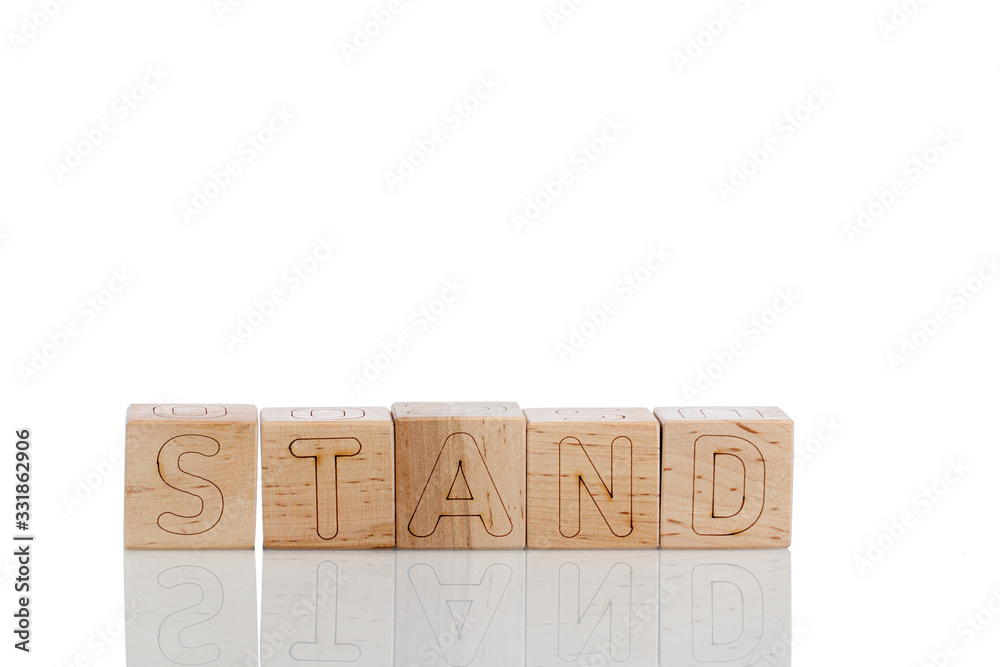 Wooden cubes with letters stand on a white background