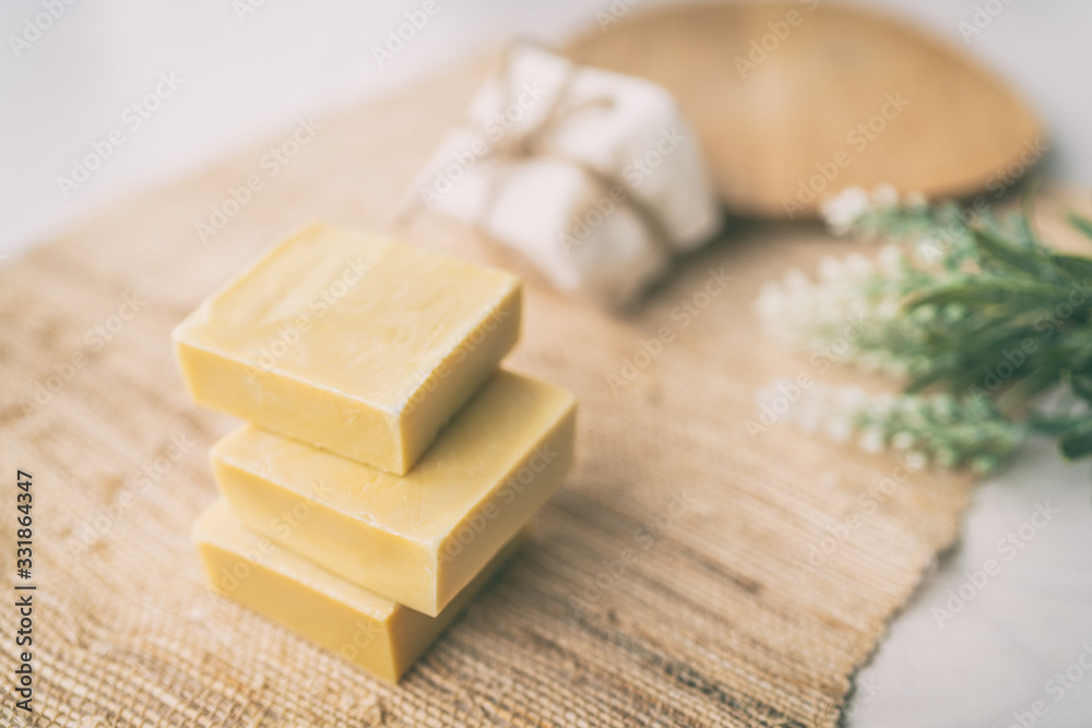 DIY handmade soap natural homemade olive oil bars of soaps easy to do at home with lavender aromas from essential oils, on ramie texture background. DIY handmade soap natural homemade olive oil bars of soaps easy to do at home with lavender aromas from essential oils, on ramie texture background.