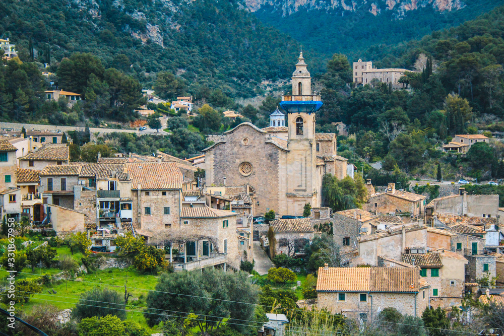 The village of Valldemossa with the parish church of sant bartomeu, Mallorca, Spain