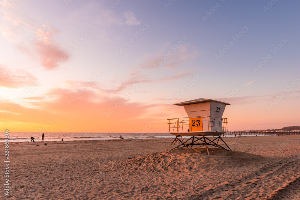 Lifeguard Tower on the beach at sunset - obrazy, fototapety, plakaty 