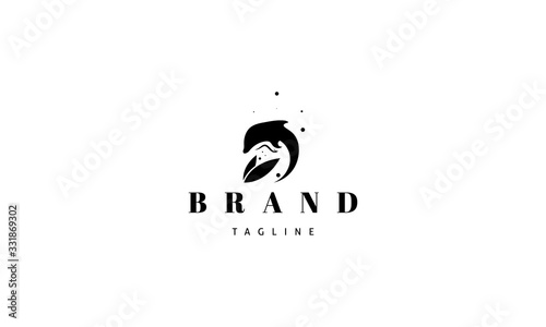 Vector logo on which an abstract image of a jumping dolphin and two leaves.