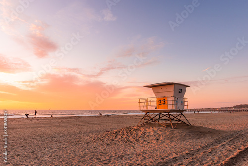Lifeguard Tower on the beach at sunset © Thanasith