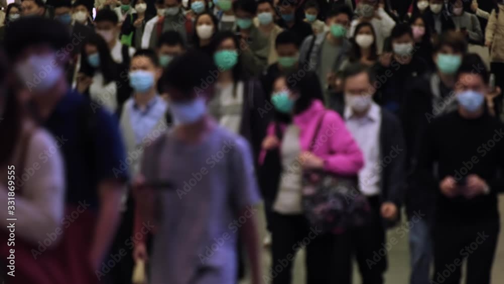 Slow motion of blurred unrecognized people wearing medical face masks at metro in Hong Kong. Slow motion of blurred unrecognized people wearing medical face masks at metro in Hong Kong.