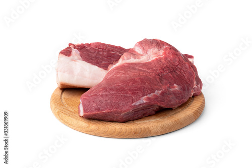 Raw pork shoulder meat on wooden board isolated on white background.