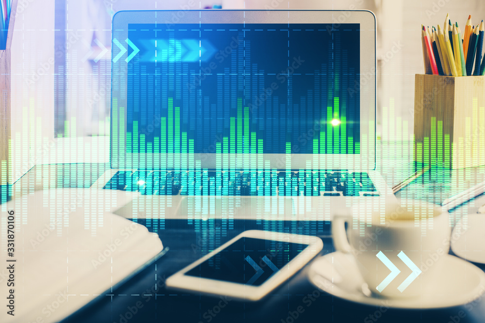 Financial market graph hologram and personal computer on background. Multi exposure. Concept of forex. Financial market graph hologram and personal computer on background. Multi exposure. Concept of forex.
