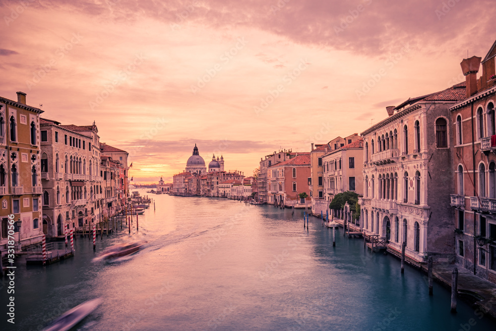 Famous travel destination, Venice Italy sunset view over Grand Canal. Peaceful sunset landscape with colorful sky. Amazing scenery concept, travel and adventure banner