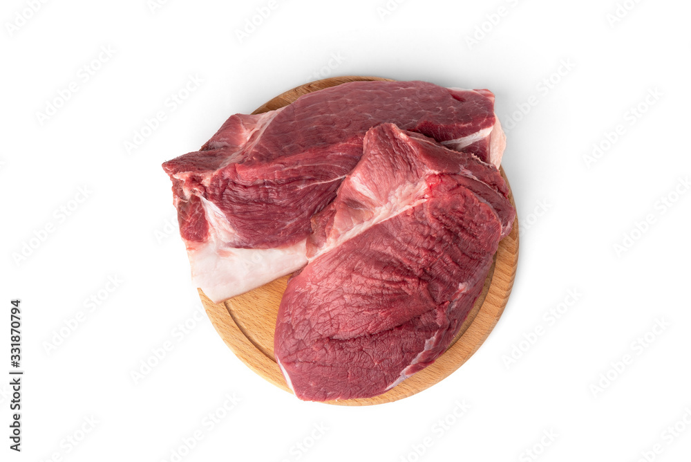 Obraz premium Raw pork shoulder meat on wooden board isolated on white background.