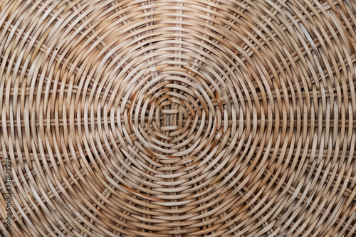 Wicker circular texture of a basket of natural ingredients. Texture and background of wood. Use of natural materials