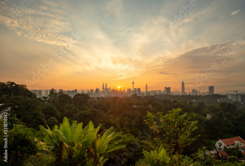 Majestic sunrise over downtown Kuala Lumpur with Petronas Twin Towers and KL Tower still among the significant landmarks and icon for Malaysia. © Nasri Zain