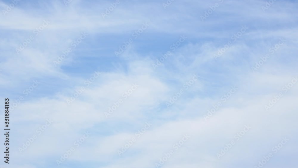 Cirrus thin, white, wispy of clouds are streak across the blue sky Cirrus thin, white, wispy of clouds are streak across the blue sky