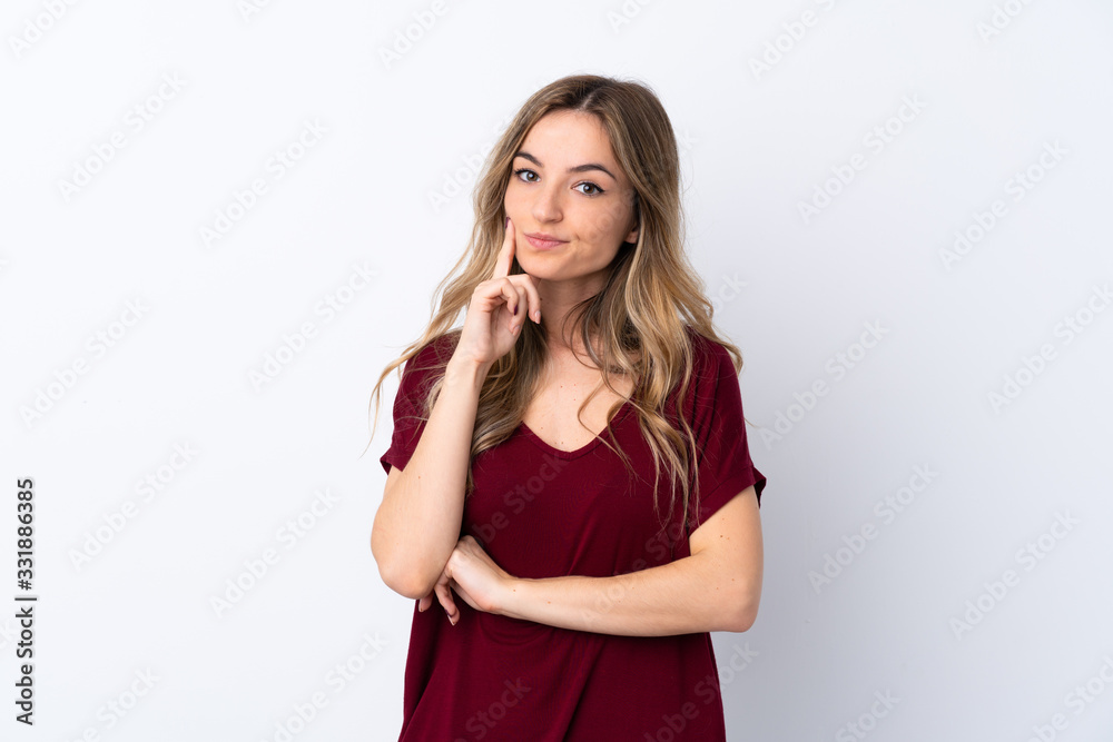 Young woman over isolated white background Looking front Young woman over isolated white background Looking front