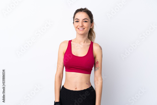 Young sport woman over isolated white background happy and smiling © luismolinero
