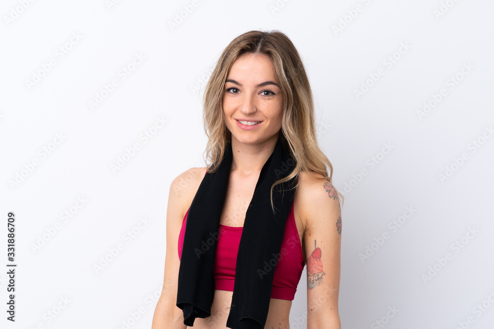 Young sport woman over isolated white background with sport towel Young sport woman over isolated white background with sport towel