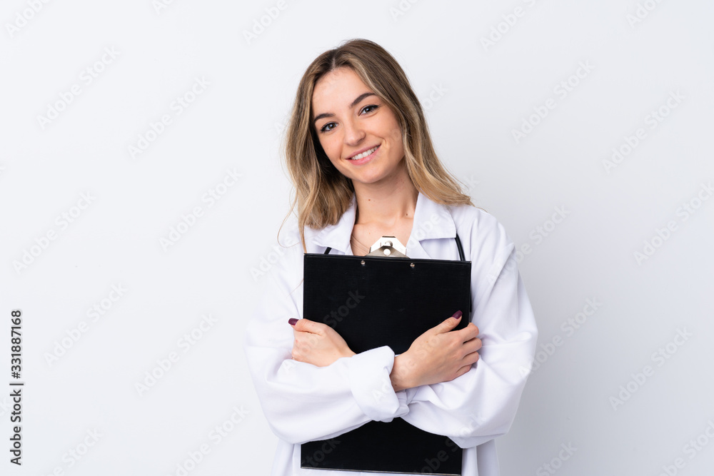 Young woman over isolated white background wearing a doctor gown and holding a folder Young woman over isolated white background wearing a doctor gown and holding a folder