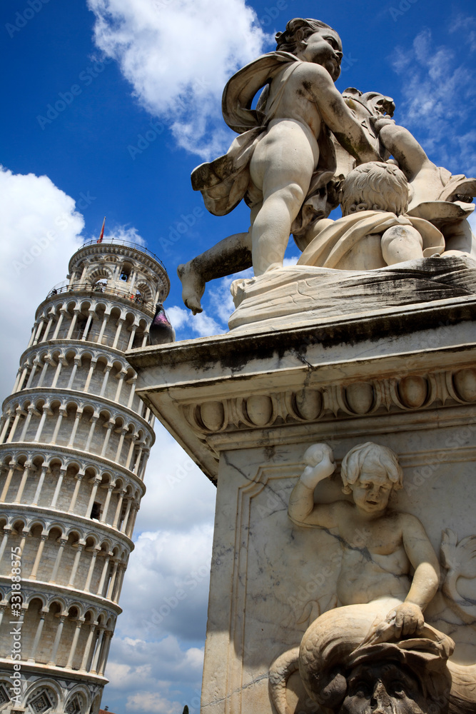 Pisa (PI), Italy - June 10, 2017: The famous Learning Tower of Pisa with an angel sculpture , Tuscany, Italy, Europe