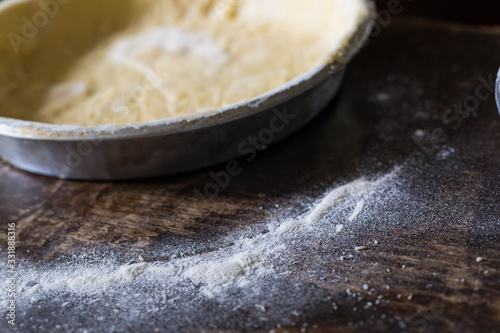 Preparation of Easter cake, also called Pastiera Napoli, typical homemade dessert, with eggs, flour, sugar and vanilla, wheat and colored sugared almonds