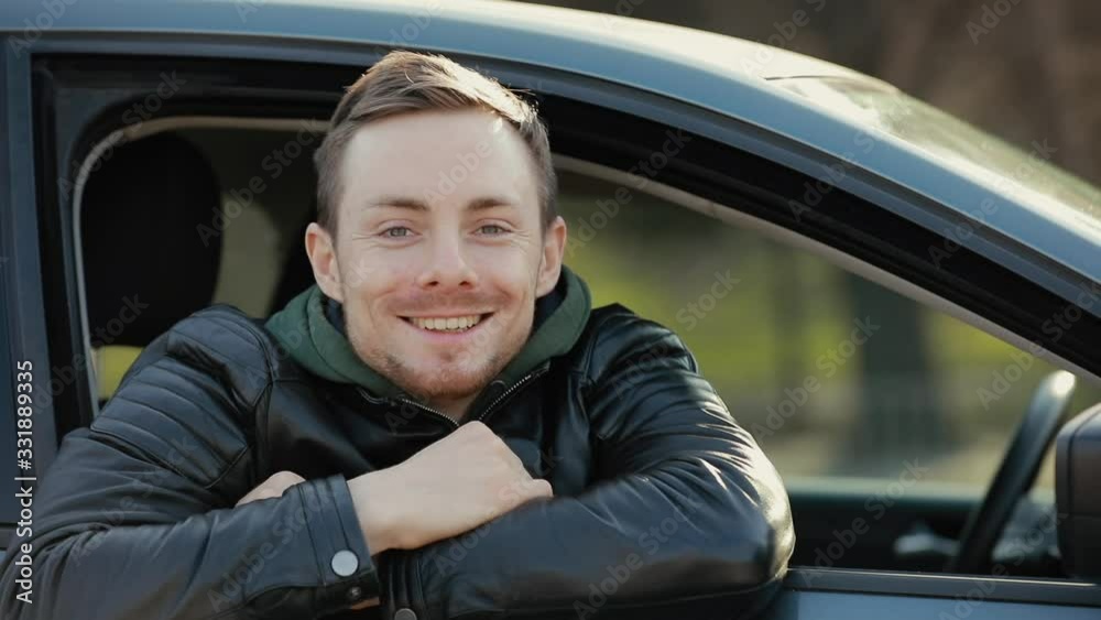 Man in surgical mask looking through window in a car for breathing dirty air Man in surgical mask looking through window in a car for breathing dirty air