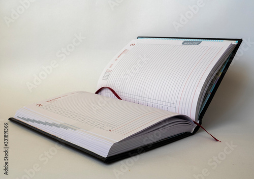 Black leather notebook on white background