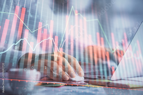 Wallpaper Mural Double exposure of forex graph with man working on computer on background. Concept of market analysis. Torontodigital.ca