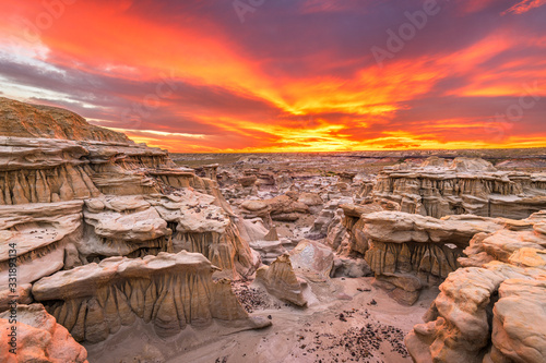 Bisti/De-Na-Zin Wilderness, New Mexico, USA at Valley of Dreams after sunset. photo