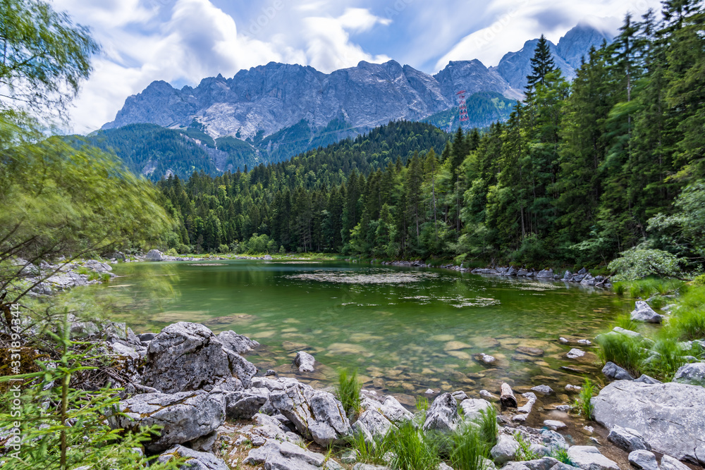 Fototapeta premium Fantastic round hike around the beautiful Eibsee at the Tiroler Zugspitze Arena
