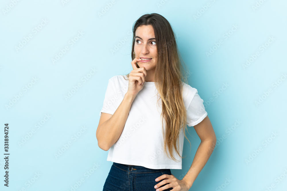 Young caucasian woman over isolated background nervous and scared Young caucasian woman over isolated background nervous and scared
