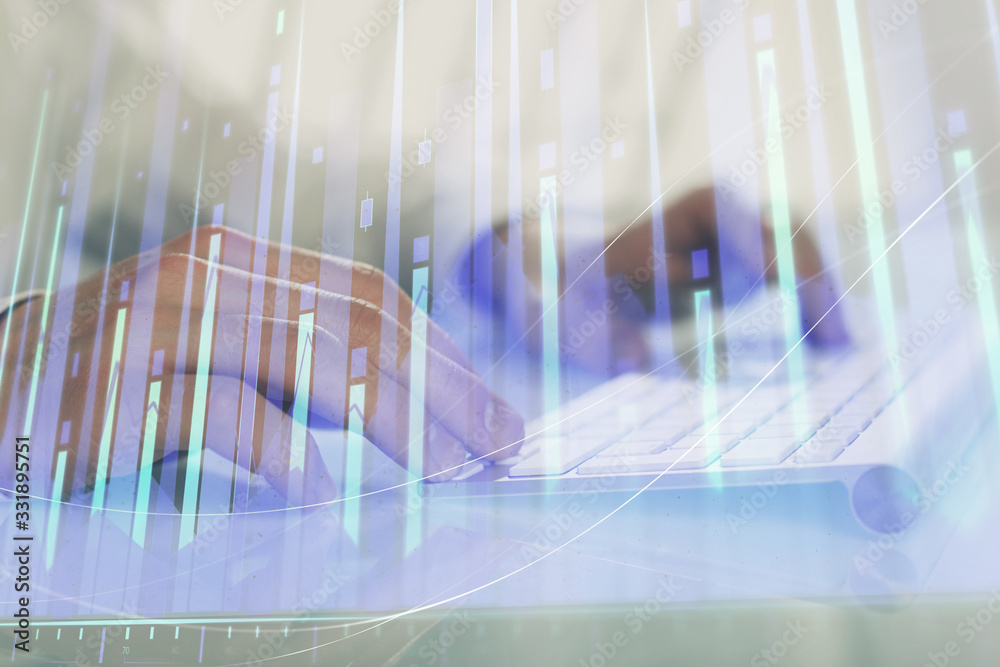 Double exposure of graph with man typing on computer in office on background. Concept of hard work. Double exposure of graph with man typing on computer in office on background. Concept of hard work.