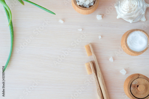  natural antisepti concept with spa setting. composition with Dead sea salt, coconut, natural cosmetic blue clay, soda, loofah. Flat lay, Spa concept with cotton flower, stones and towel. Copy space