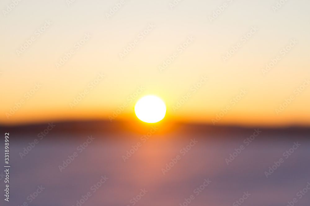 Sunset over snowy field
