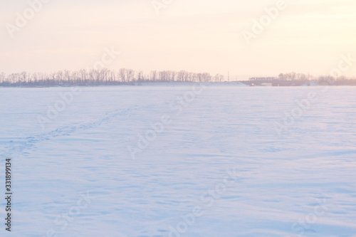 Sunset over snowy field