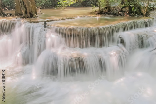 Beautiful soft silky white water flowing on arch rock with nature background  Huay Mae Khamin Waterfall floor 6th  Dong Pee Sua  Kanchanaburi  west of Thailand.