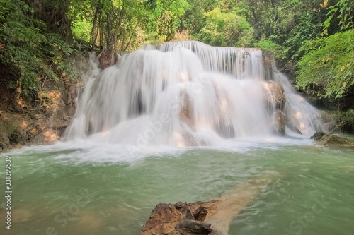 view of white silky water flowing around with green forest background  Huay Mae Khamin Waterfall floor 3th  Wang Nar Pha  Kanchanaburi  west of Thailand.