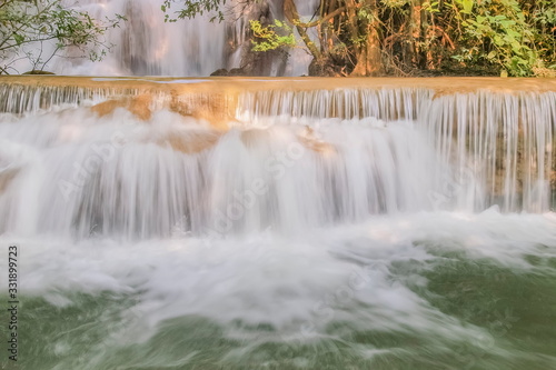 view of white silky water flowing around with green forest background  Huay Mae Khamin Waterfall floor 3th  Wang Nar Pha  Kanchanaburi  west of Thailand.