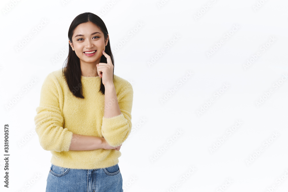 Happy satisfied young female asian student touching clean glowing skin, smiling upbeat, feeling delighted after trying new cosmetology procedure, standing white background pleased