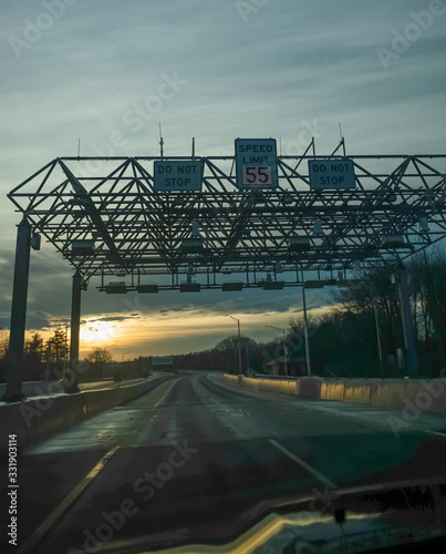 Perspective of highway at dusk - Maine turnpike.