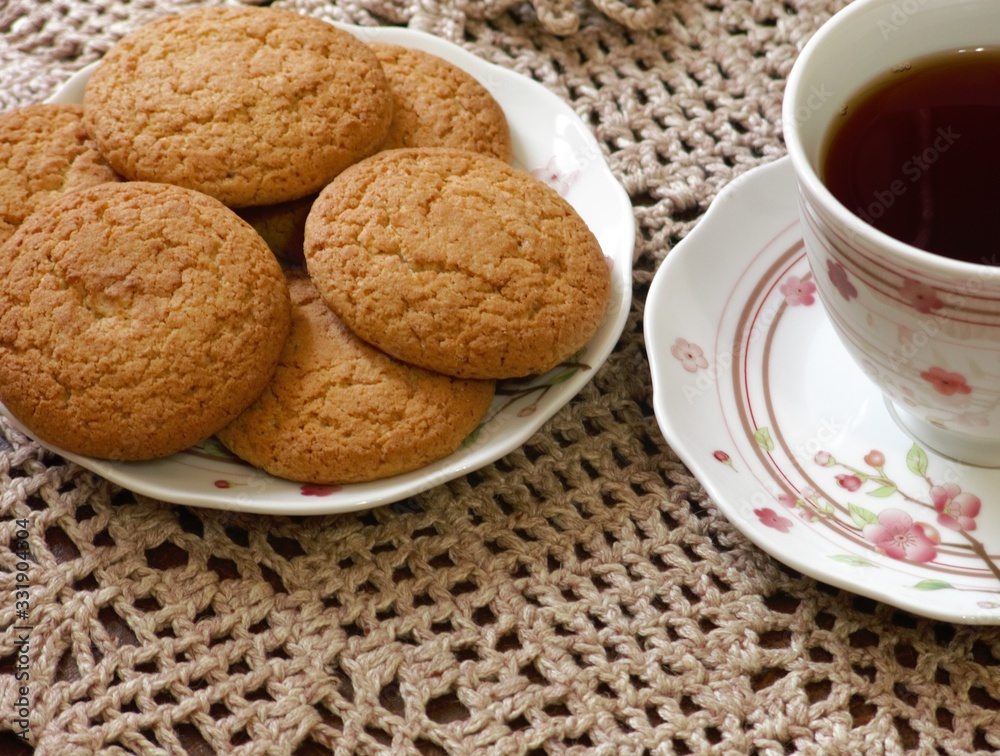 Oatmeal cookies are round or oval shaped pastry with oatmeal or flour in the composition. Oatmeal cookies are round or oval shaped pastry with oatmeal or flour in the composition.
