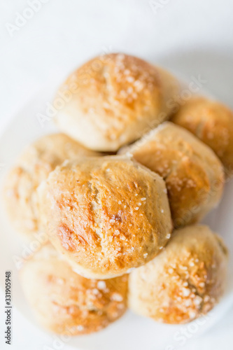 Fresh salty bread buns pastry topped with salt