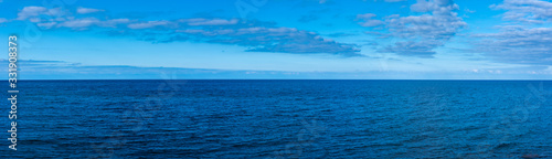 looking into the wide open ocean of the mediteranen sea on the island of mallorca during a wonderful sunny day with a beautful blue sky 