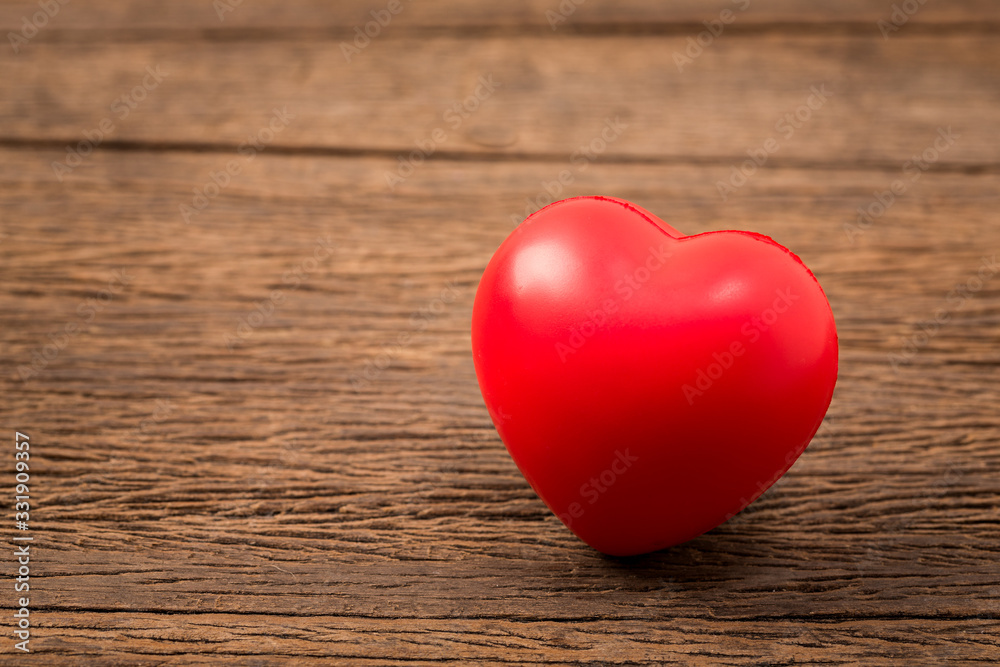 Valentine day background. Red love heart on grunge wooden background. Retro filter