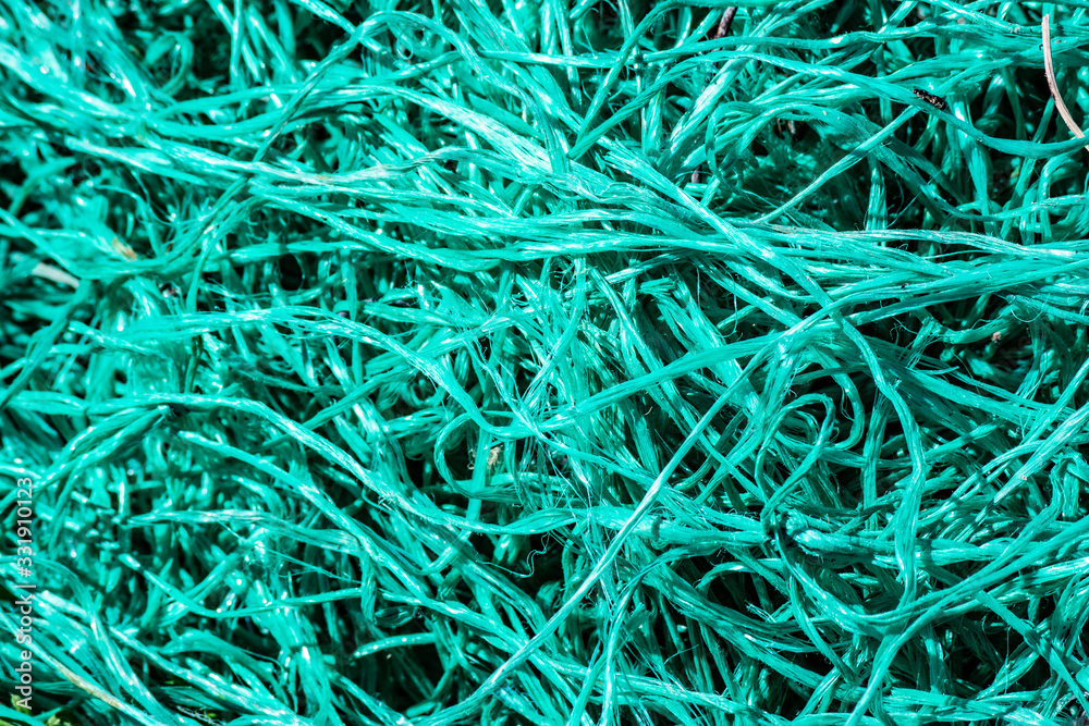 Close up of entangled turquoise nets Close up of entangled turquoise nets