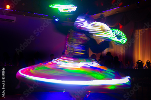 Dance of the Egyptian dervishes Tanura show. Light texture, blur background for design. photo