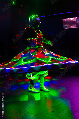 Dance of the Egyptian dervishes Tanura show. Light texture, blur background for design. photo