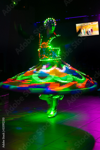 Dance of the Egyptian dervishes Tanura show. Light texture, blur background for design. photo