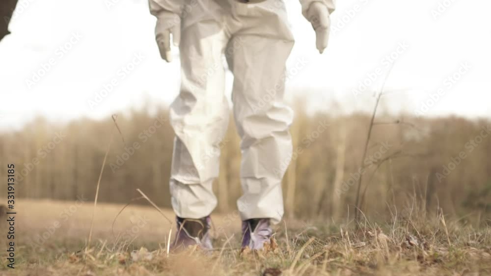 A man in a protective suit with a soccer ball A man in a protective suit with a soccer ball