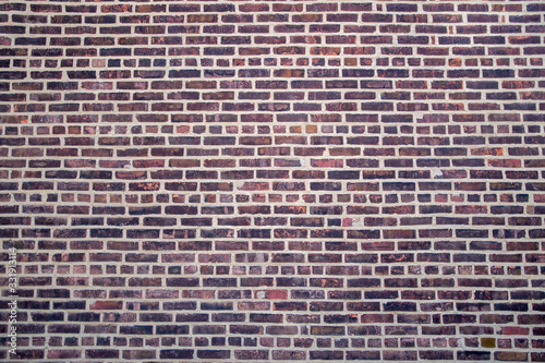 Brick wall fragment of an old building in New York City under natural light. Close-up. Texture. Background.