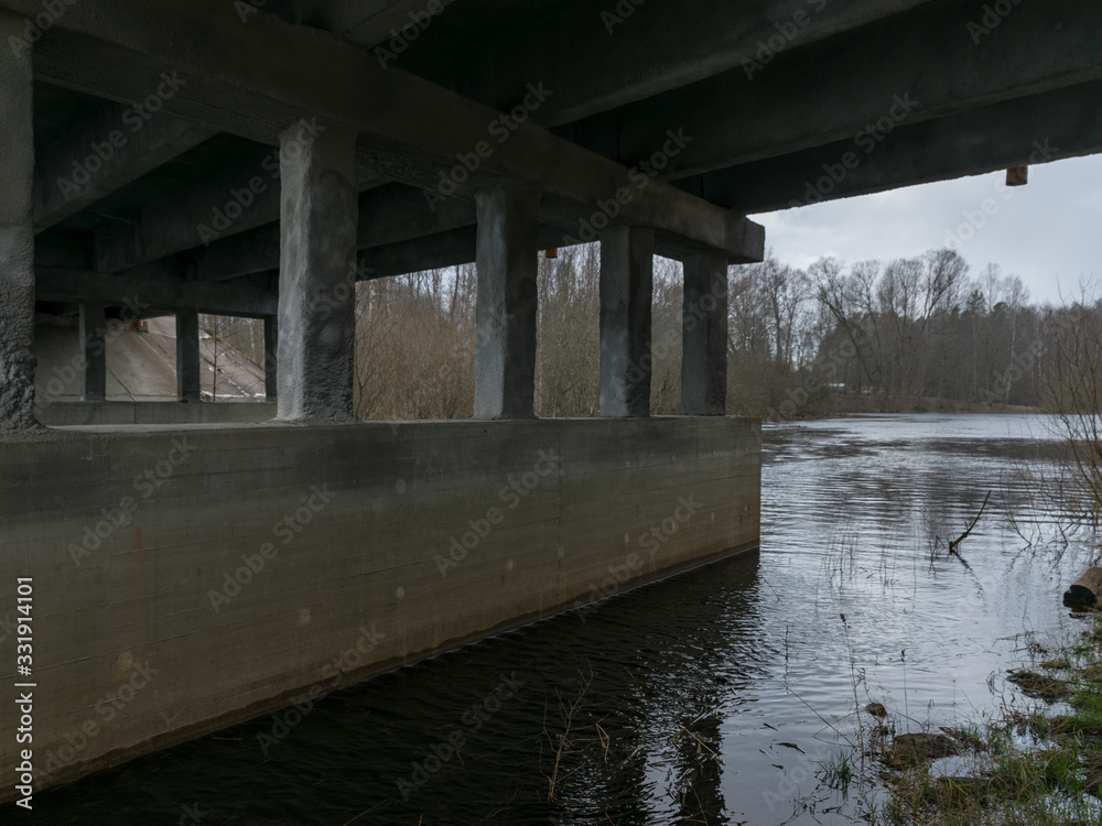 concrete bridge over the river, spring day concrete bridge over the river, spring day
