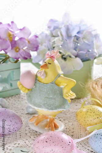 Fototapeta Naklejka Na Ścianę i Meble -  easter card with funny hen figurine  and colorful eggs