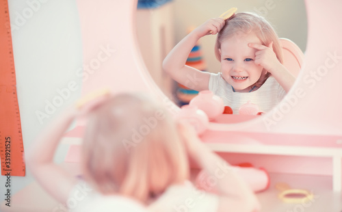 A small child is playing with toy photo