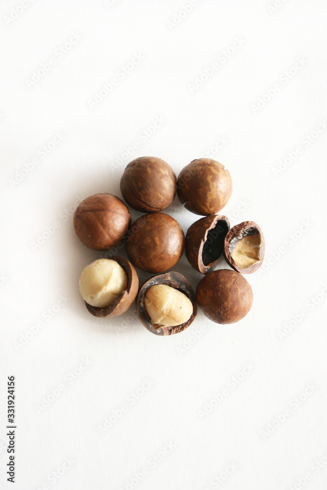 Macadamia nut  on white background with copyspace. Natural background of macadam nuts