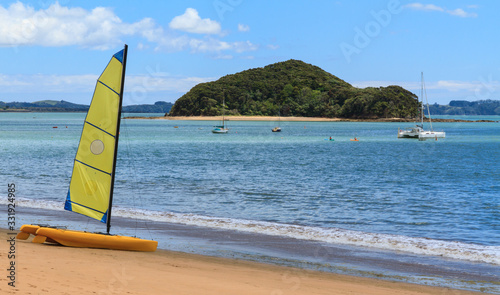 Bild auf Leinwand A sailing catamaran on the beach at Paihia in the Bay of Islands, New Zealand